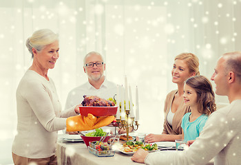 Image showing smiling family having holiday dinner at home