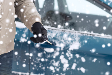 Image showing close up of man with car key outdoors