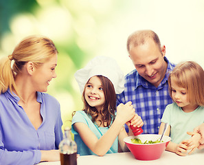 Image showing happy family with two kids eating at home