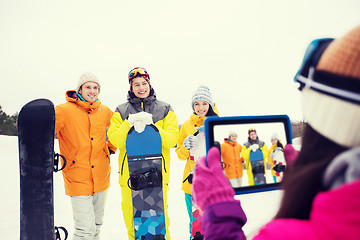 Image showing happy friends with snowboards and tablet pc