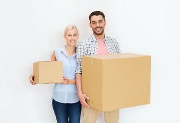 Image showing couple with cardboard boxes moving to new home