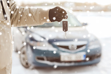 Image showing close up of man with car key outdoors