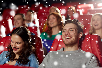 Image showing happy friends watching movie in theater
