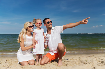 Image showing happy family in sunglasses on summer beach