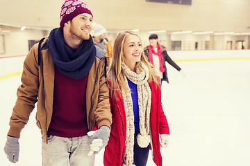 Image showing happy friends on skating rink