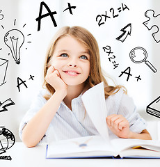 Image showing little student girl studying at school