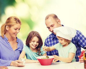 Image showing happy family with two kids eating at home