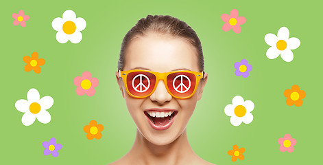 Image showing happy teenage hippy girl in shades with peace sign