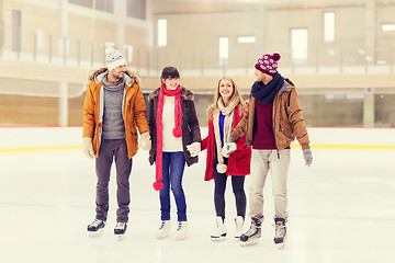 Image showing happy friends on skating rink