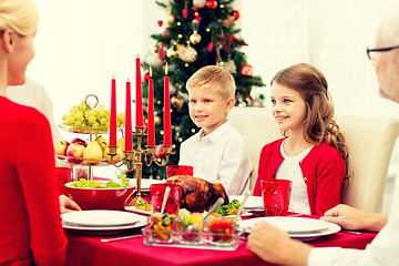 Image showing smiling family having holiday dinner at home