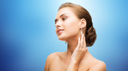 Image showing beautiful woman with diamond earrings and bracelet