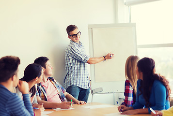 Image showing group of smiling students with white board