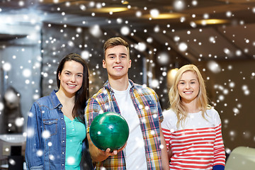 Image showing happy friends in bowling club at winter season