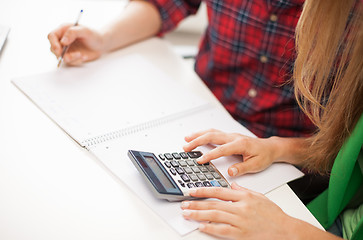 Image showing students with notebook and calculator at school