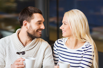 Image showing happy couple meeting and drinking tea or coffee