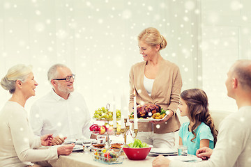 Image showing smiling family having holiday dinner at home