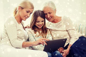 Image showing smiling family with tablet pc at home