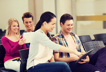 Image showing group of smiling students with tablet pc