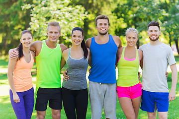 Image showing group of happy friends or sportsmen outdoors