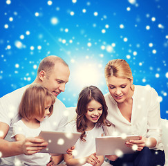 Image showing happy family with tablet pc computers