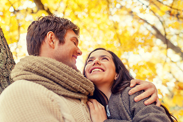 Image showing smiling couple hugging in autumn park