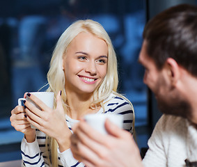 Image showing happy couple meeting and drinking tea or coffee