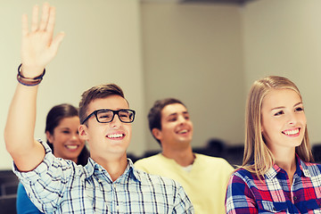 Image showing group of smiling students in lecture hall