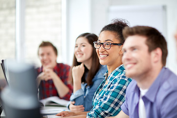 Image showing happy high school students in computer class