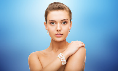 Image showing beautiful woman with pearl earrings and bracelet