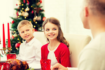 Image showing smiling family having holiday dinner at home