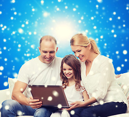 Image showing smiling family with laptop