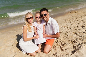 Image showing happy family in sunglasses on summer beach