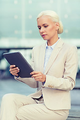 Image showing businesswoman working with tablet pc outdoors