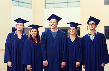 Image showing group of smiling students in mortarboards