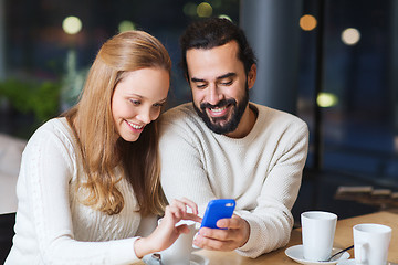 Image showing happy couple with tablet pc and coffee at cafe