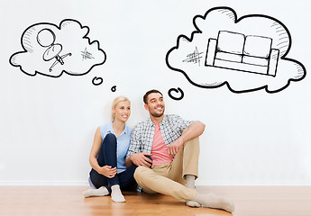 Image showing happy couple of man and woman moving to new home