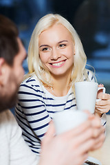 Image showing happy couple meeting and drinking tea or coffee