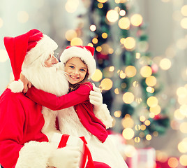 Image showing smiling little girl with santa claus