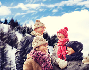 Image showing happy family in winter clothes outdoors