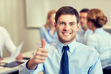 Image showing group of smiling businesspeople meeting in office