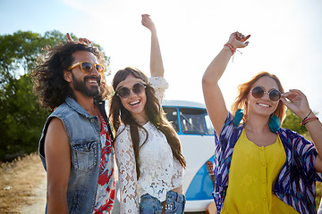 Image showing happy young hippie friends dancing outdoors
