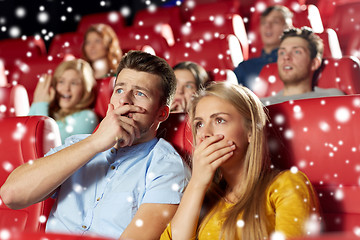 Image showing friends or couple watching horror movie in theater