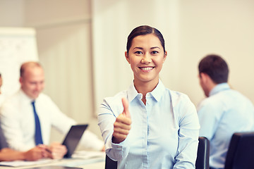 Image showing group of smiling businesspeople meeting in office