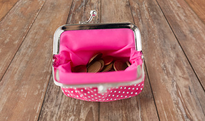 Image showing close up of euro coins in wallet on wooden table