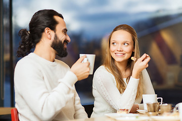 Image showing happy couple meeting and drinking tea or coffee