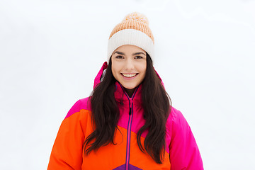 Image showing happy young woman in winter clothes outdoors