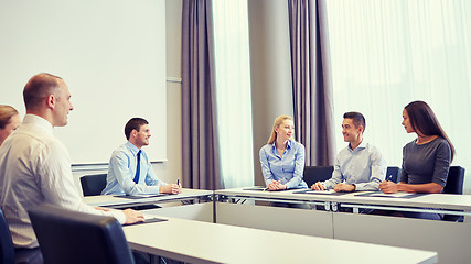 Image showing group of smiling businesspeople meeting in office