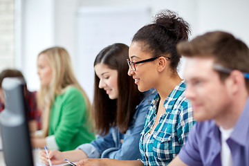 Image showing happy high school students in computer class