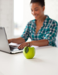 Image showing close up of student girl with laptop and apple