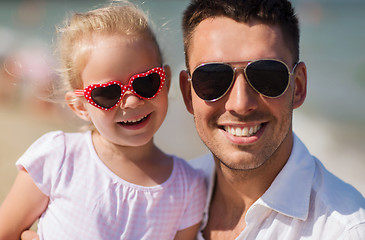 Image showing happy family in sunglasses on summer beach